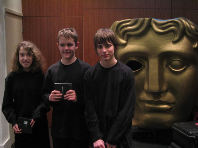 Stepping Stones pupils in front of BAFTA mask