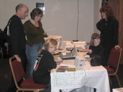 James Bloomfield and Lys look on as the children show their work