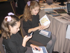 Children from Matching Green School using mobile phones as part of a Space Adventure!