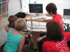 Inside the Stepping Stones marquee, podcasting with Carol and Daniel