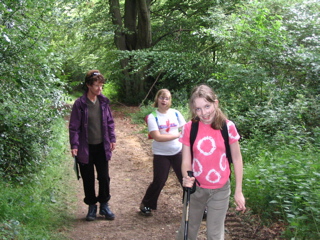 Rosie, Jessica and Amie in woodland.