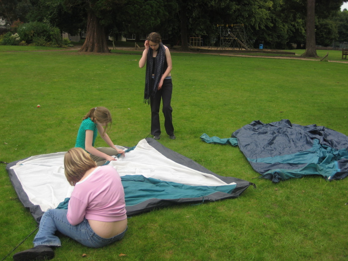 The girls begin by putting in the tent poles. Excellent teamwork girls!