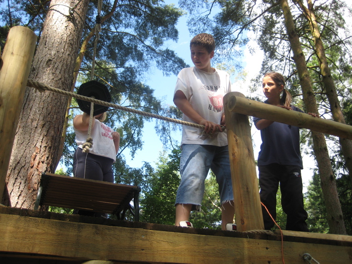 Jamie manages safety on the zip line