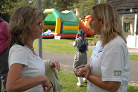 Ali Grafton (right) talks to a parent about Occupational Therapy