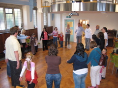 Children and parents "warm up" as the workshop begins